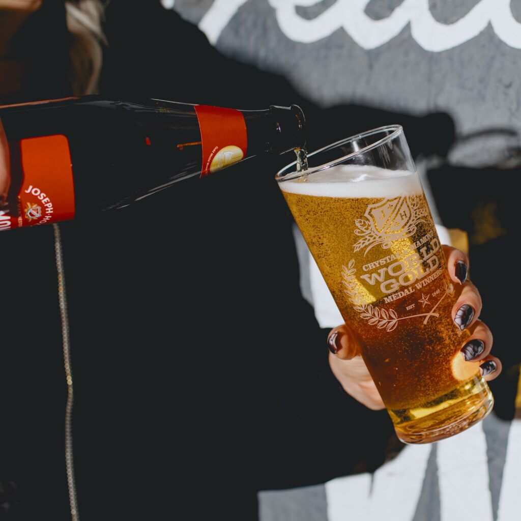 Diamond bottle pouring beer into a glass.