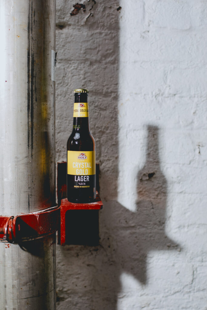 A Crystal Gold bottle on a ledge.