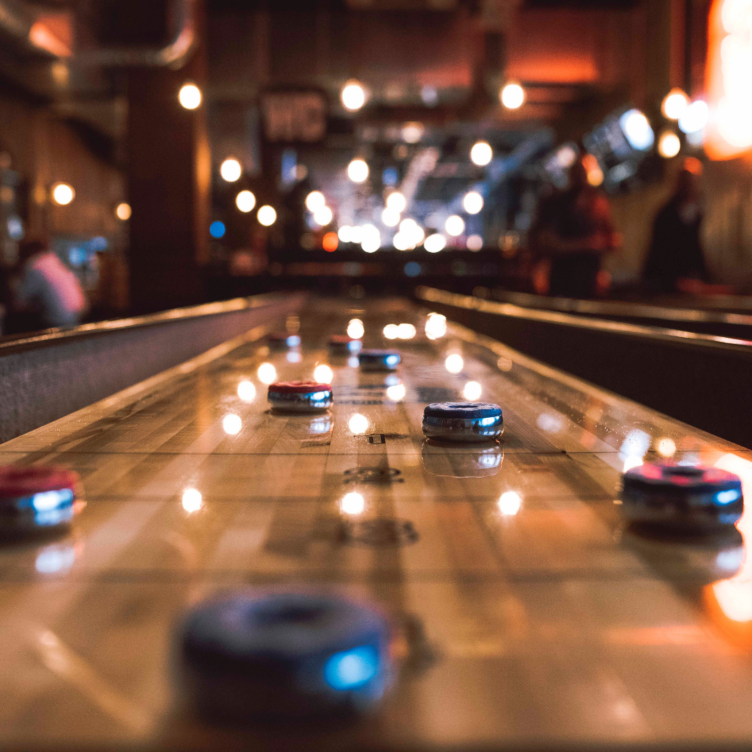 Shuffleboard puks on the board